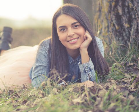 Finding Happiness, Pretty Girl Laying Under Tree And Smiling.