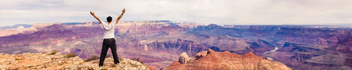 how to Build Self-Confidence, grand canyon man outstretched arms.