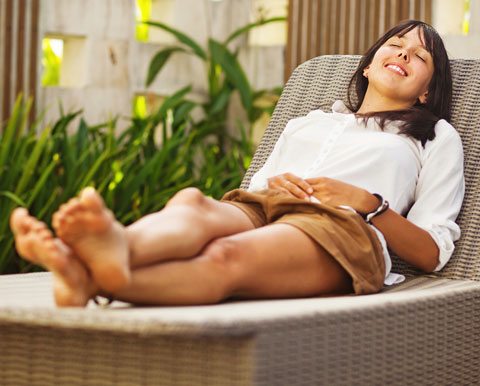 Relaxation Techniques, Woman Laying Comfortably On Chaise Lounge With Eyes Closed