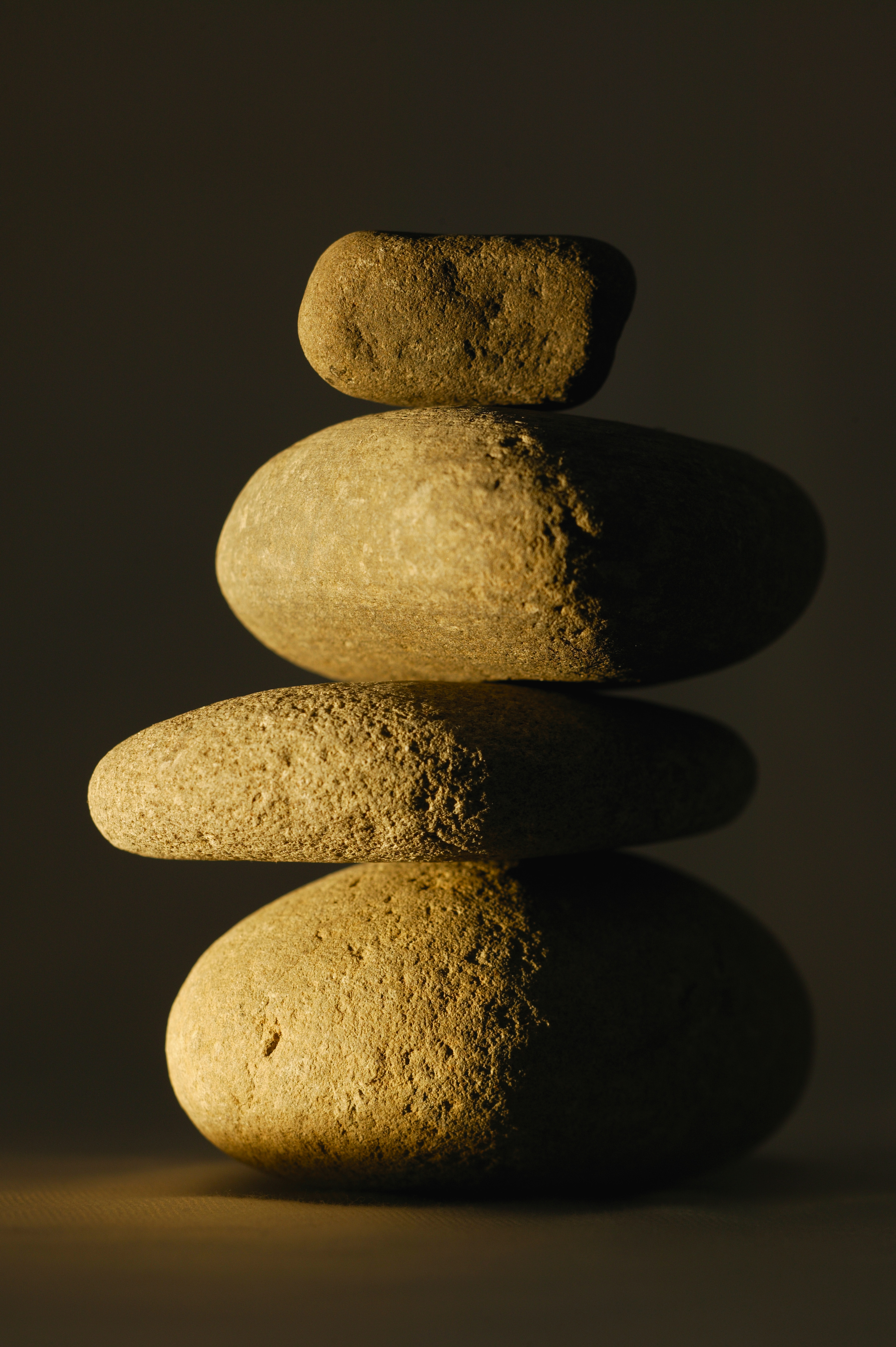 Benefits of meditation balancing river rocks shadow and light