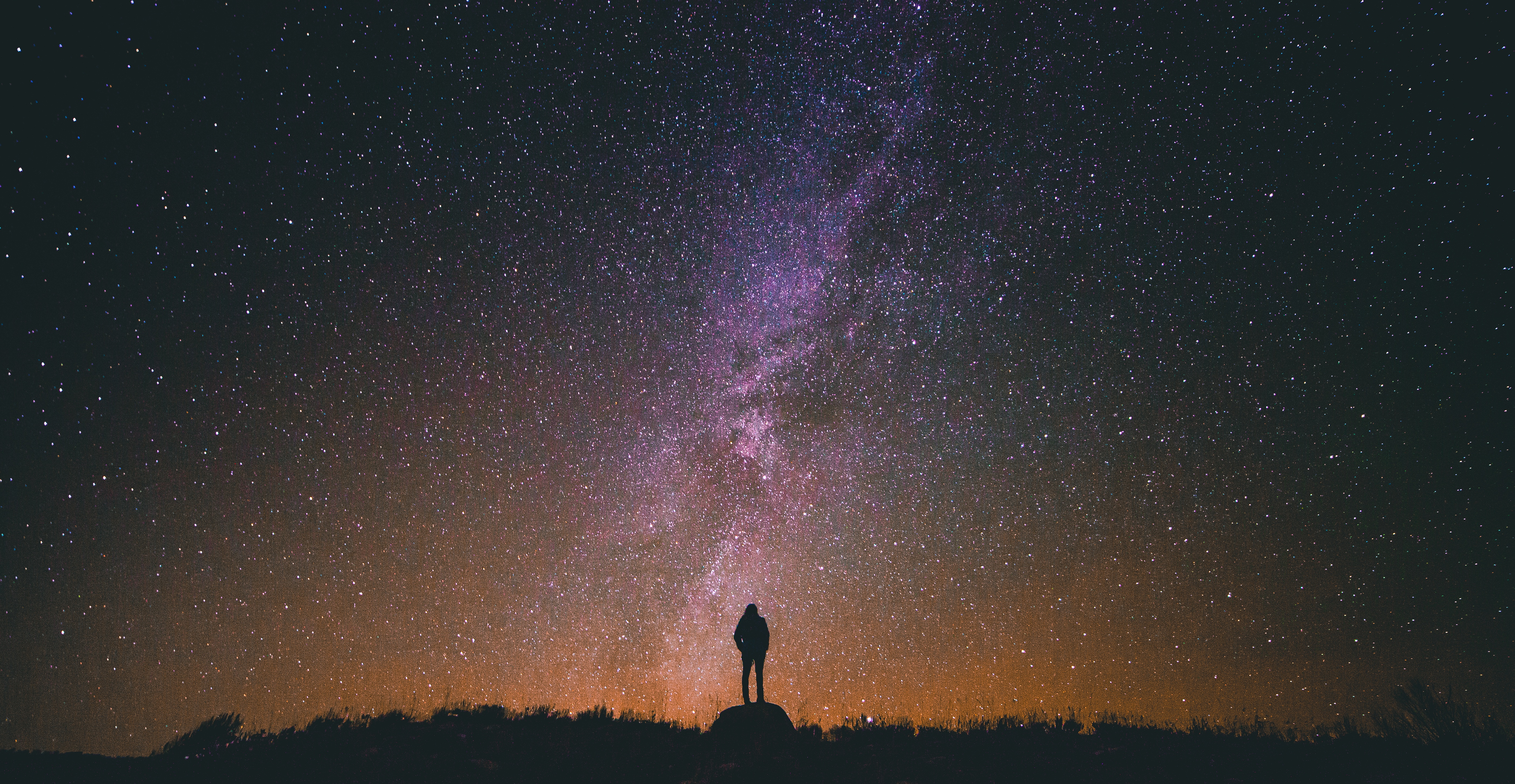 What is hypnosis? Image of persons silhouette against a starry night and the milky way 