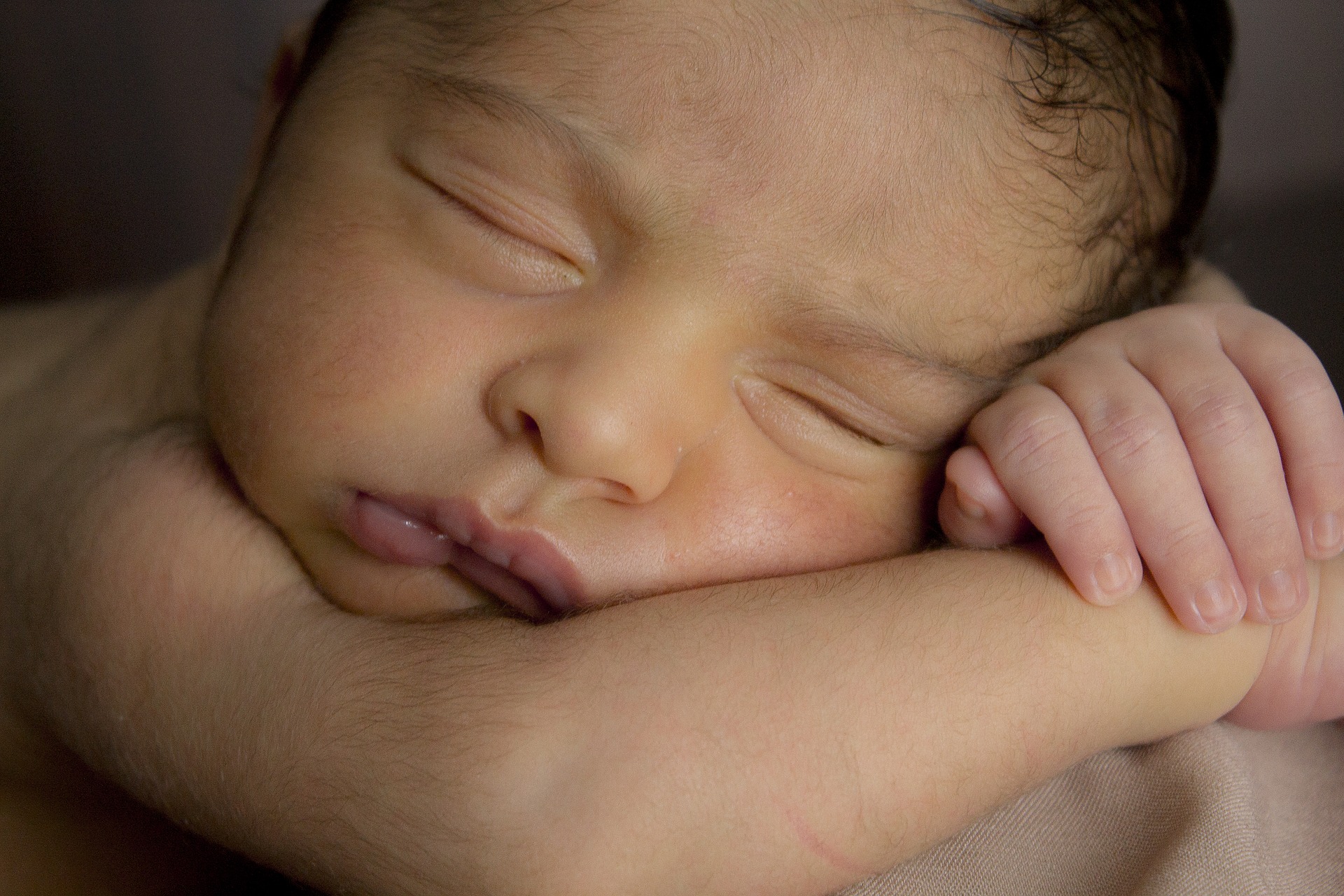 Nature sounds for sleep -baby fast asleep cradling their head in their own arms