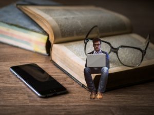 spiritual awakening man reading on large book