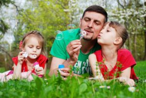 manifesting abundance happy dad with kids