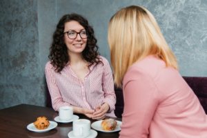 self confidence tips - two women enjoying a meal together